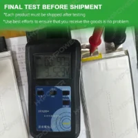 Anode-free battery cell internal resistance test before shipment showing 0.90mΩ and 3.529V on a battery meter